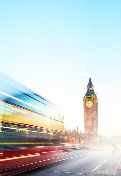 istock Big Ben with blurred double-decker bus in London UK 525649263