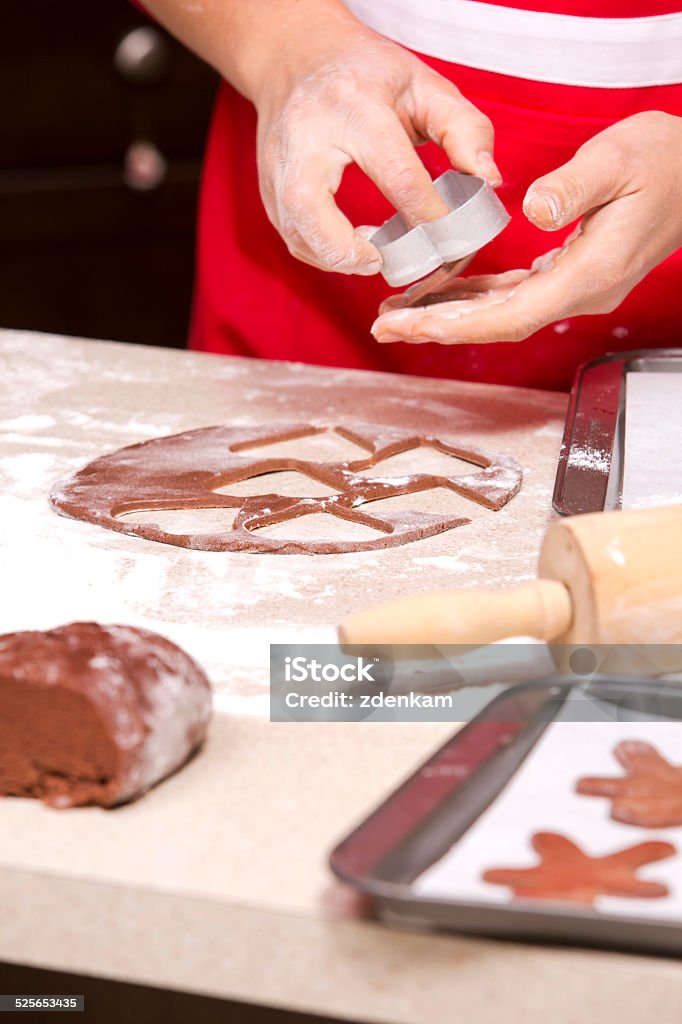 ginger bread cookies woman making ginger bread cookies in the kitchen Adult Stock Photo