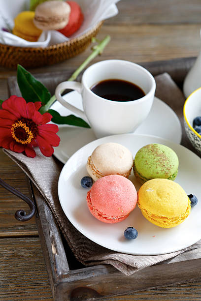 istock delicious macaroon on a plate with coffee 525654167