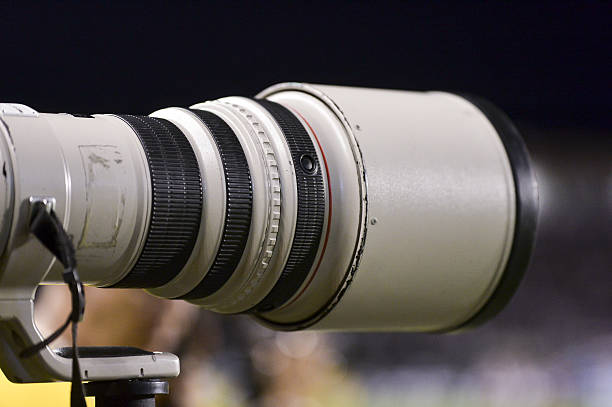 telephoto lens Sport Lens in action - Telephoto 400mm white line in a football stadium in a blur background sports photography stock pictures, royalty-free photos & images