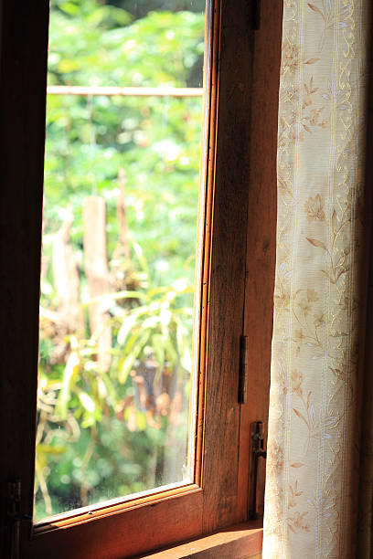 istock curtain at the window in morning 525668787