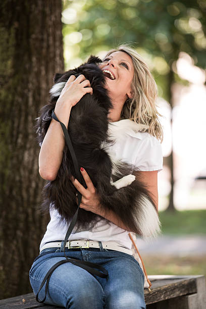 istock Woman Playing With Her Dog 525669315