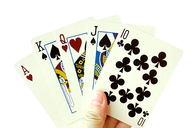 istock Playing cards in hand isolated on white background 525670007