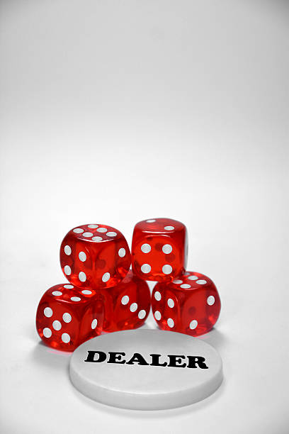 istock Poker chips with red dices and a dealer button 525672969