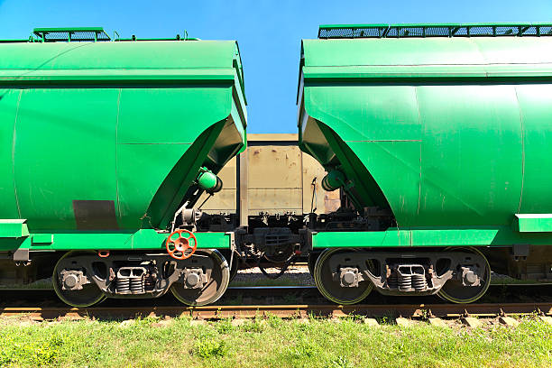 Grain transportation Grain hoppers on the railway track - cars coupling coupling stock pictures, royalty-free photos & images
