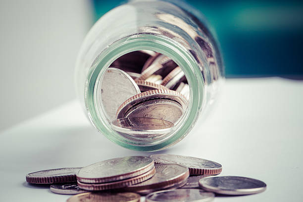 istock money in the glass bottle 525673775