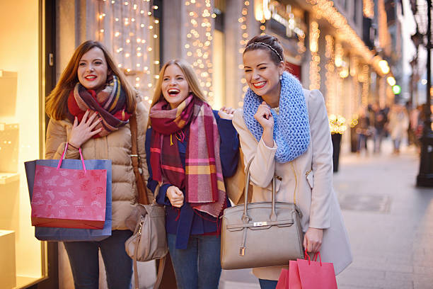 istock Young women shopping together 525673903