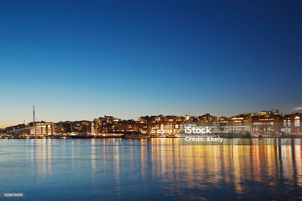 Oslo harbor at night. Nautical vessels on Oslo harbor and Aker pier at night. Harbor Stock Photo