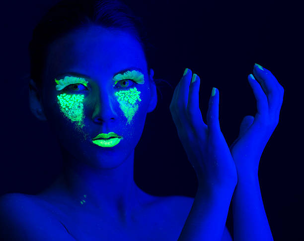 istock Woman Portrait painted with UV makeup color 525674859