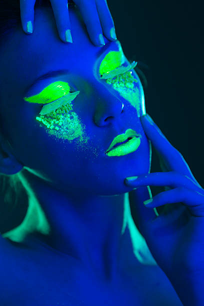 istock Woman Portrait painted with UV makeup color 525674867