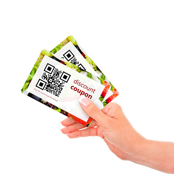 hand holding two  discount coupons with qr code hand holding two  discount coupons with qr code isolated over white background coupon photos stock pictures, royalty-free photos & images