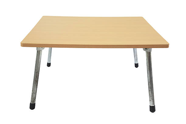 istock Wooden table with adjustable metal legs isolated 525690477
