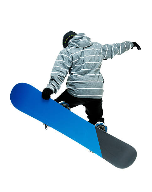 istock Rear view of snowboarder jumping snowboard 525692013