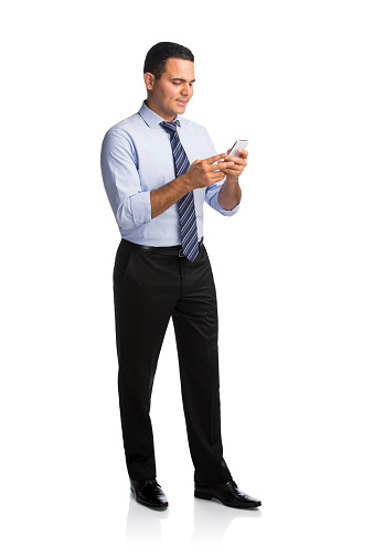 Businessman text messaging on the phone isolated over white background