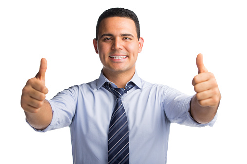 Portrait of a happy businessman showing thumbs up isolated over white background