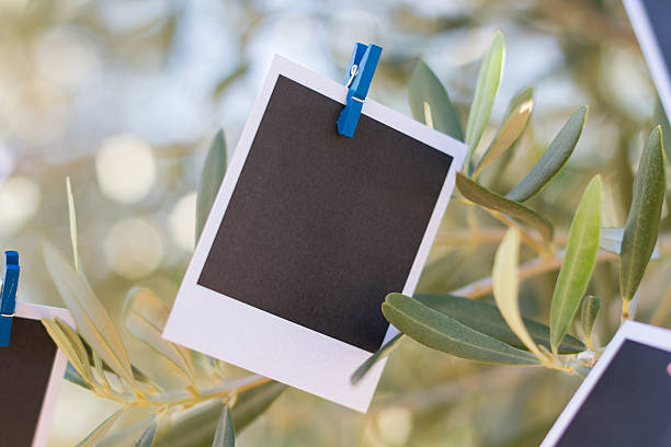 istock Two real blank instant photo hanging on clothesline. 525693105