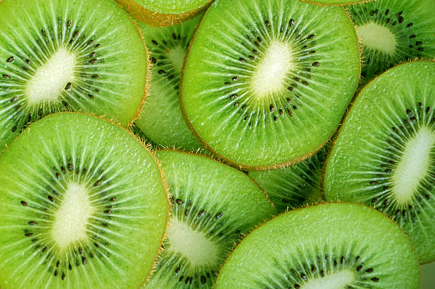 istock slice of kiwi fruit for background 525693459