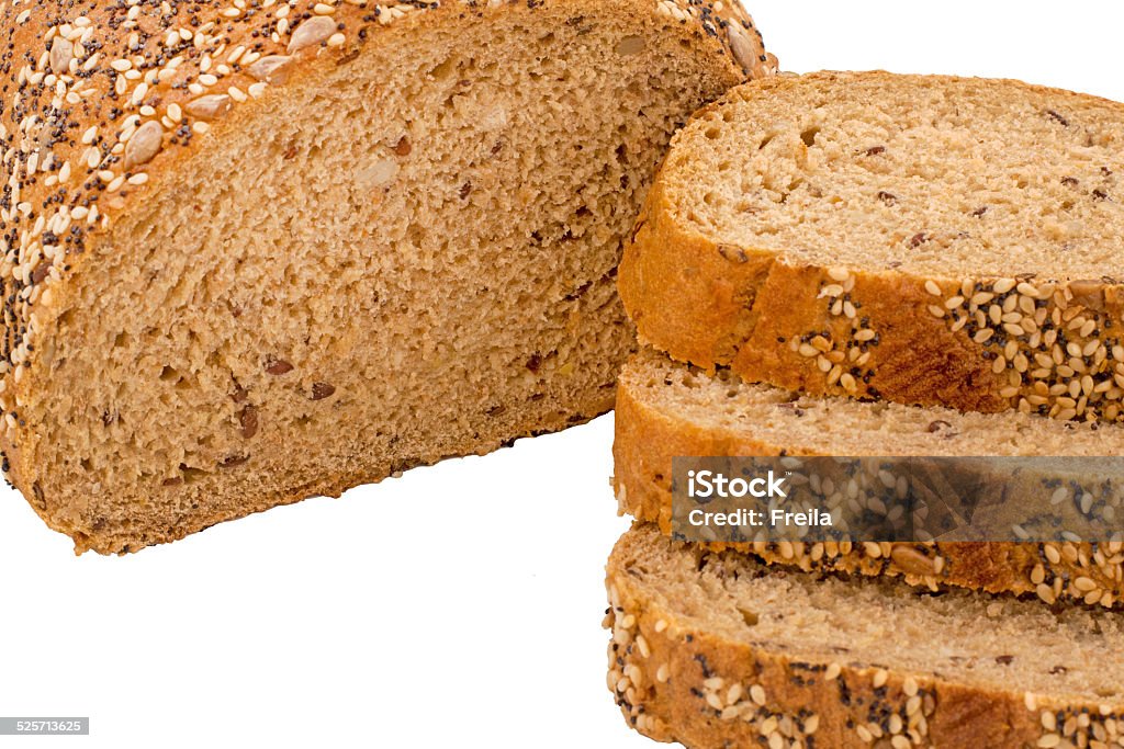 Wholemeal bread isolated wholemeal bread slice with poppy, sunflower, and sesame seeds on a bread broad 7-Grain Bread Stock Photo