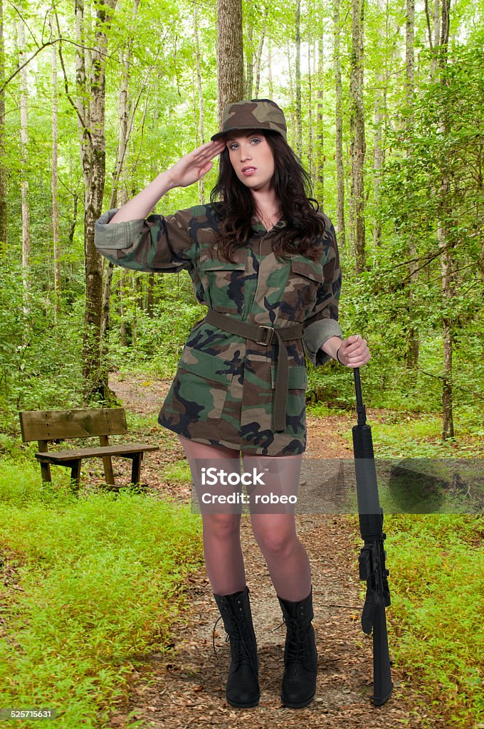 Woman Soldier Beautiful young woman soldier with a M16 rifle Adult Stock Photo