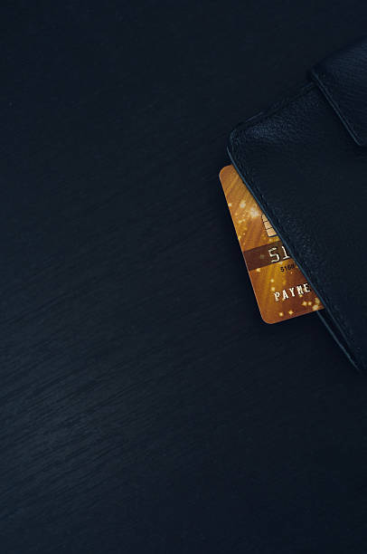 istock Black leather wallet with credit and discount cards 525715655