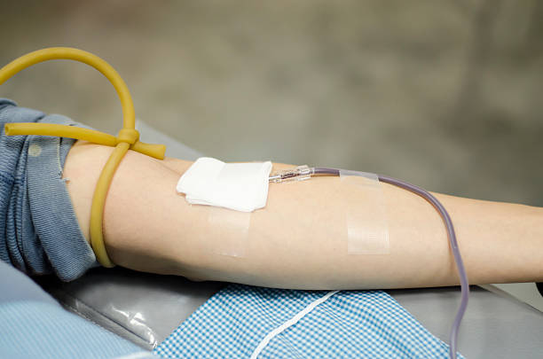 istock Closeup of blood donor at donation. 525716467