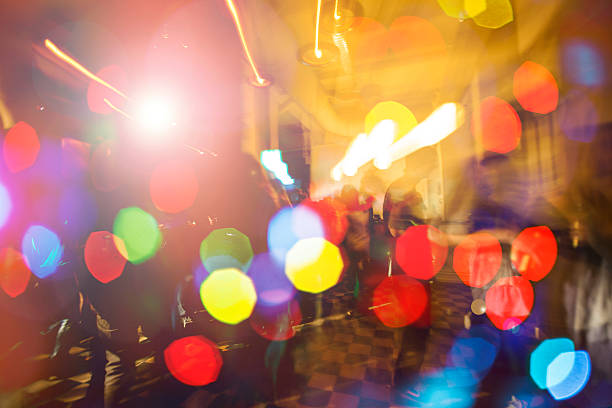 Abstract multi colored light beams background with bokeh.