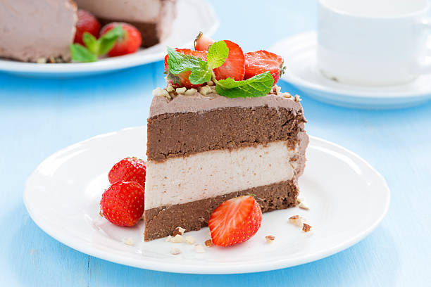 istock piece of chocolate cake with fresh strawberries 525720279