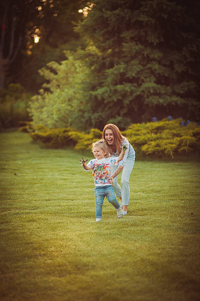 istock Mother and little daughter playing together 525726248