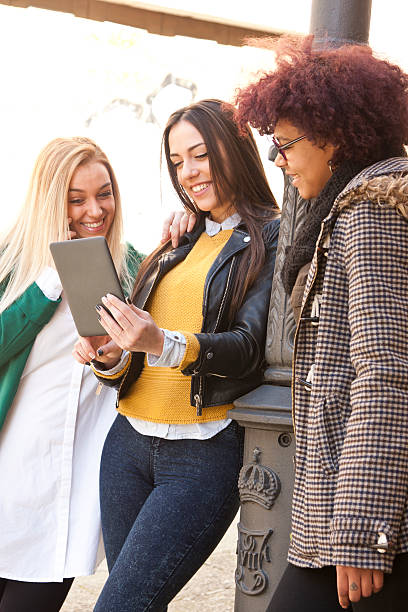 istock girls with the tablet 525728642