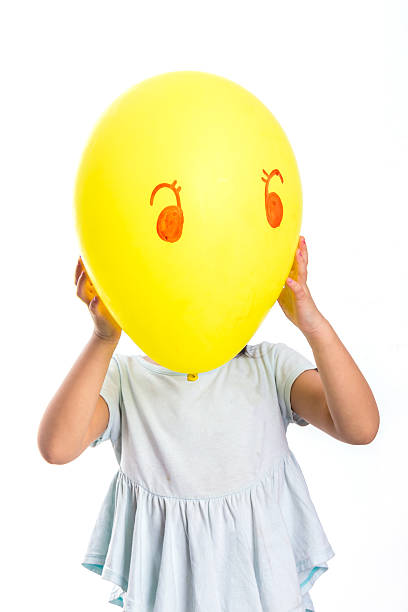 istock Girl Holding Banana 525734875