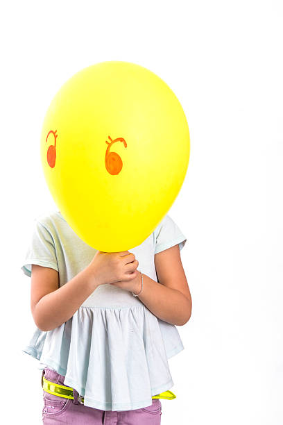 istock Girl Holding Banana 525734877