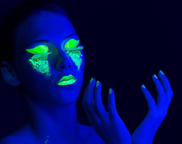 istock Woman Portrait painted with UV makeup color 525735451
