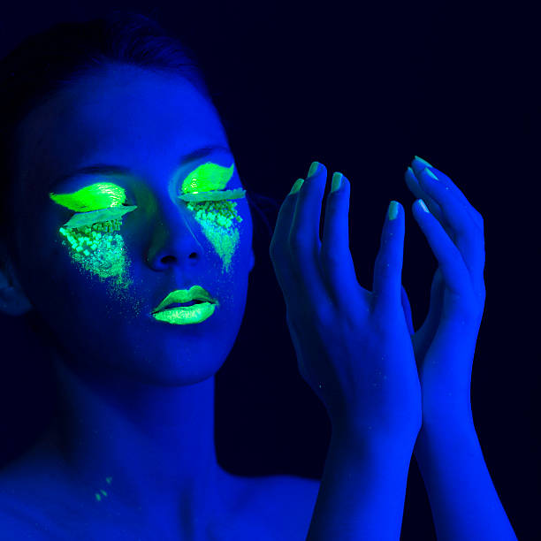 istock Woman Portrait painted with UV makeup color 525735453