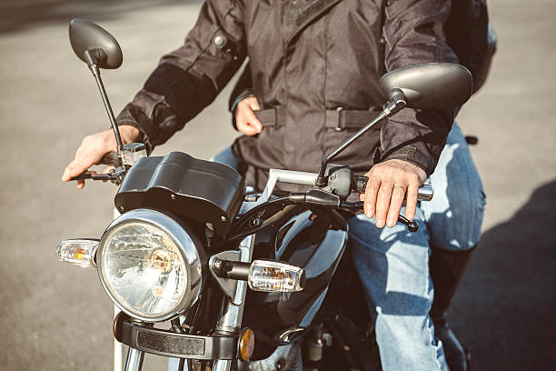 istock Senior man steering motorcycle on road 525735466