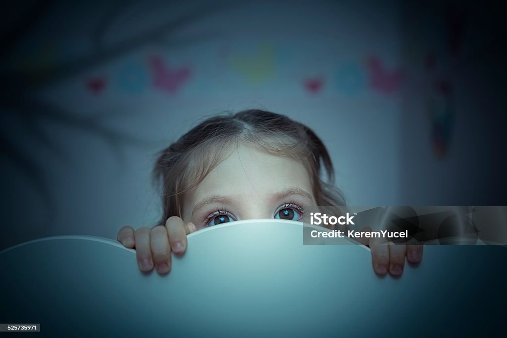 scared little girl in her bed little girl is afraid of shadow of tree Child Stock Photo