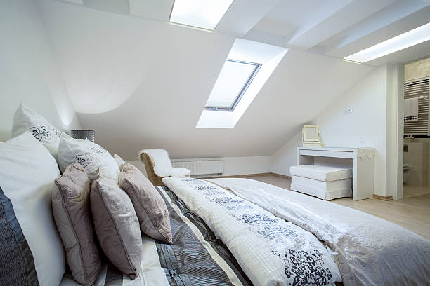 istock Comfy enormous bed in bright bedroom 525737505