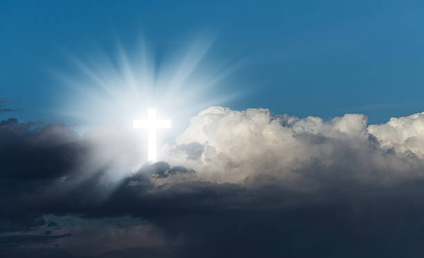 istock Glowing holy cross in the blue  sky 525737980