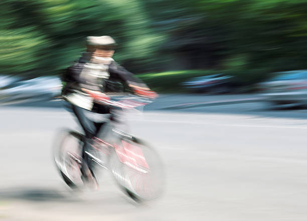 istock Boy cyclist in traffic on the city roadway 525737992