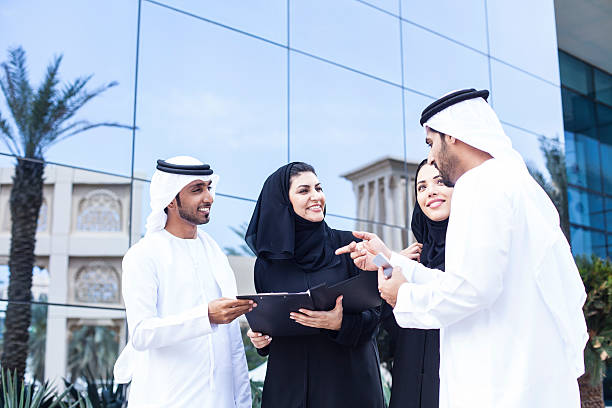 istock Arab businesspeople discussing in front of office building 525738336