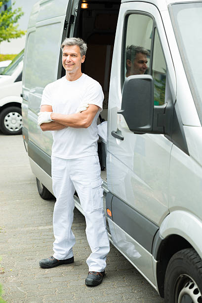 istock Painter With Arms Crossed In Front Of Van 525738680
