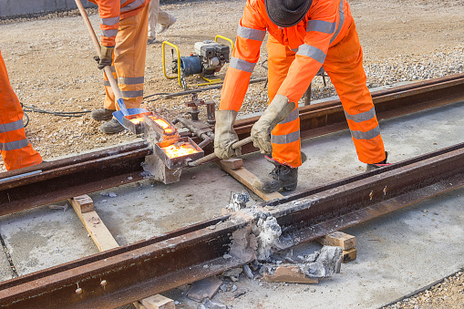 Tram track construction site, tracks being joined.Thermite welding of the rail joints.