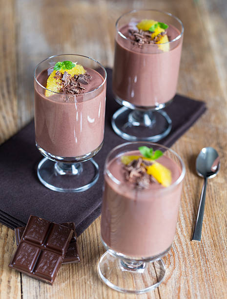 istock Chocolate pudding dessert with orange and grated chocolate 525739017