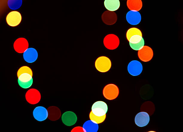 Multi-colored spots on a black background stock photo