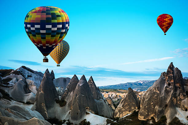 istock air balloon over poppies field Cappadocia, Turkey 525739236