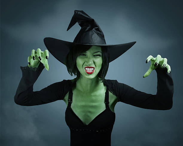 istock Scary witch with green skin 525739797