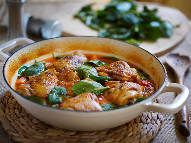 spicy chicken,spinach stew stock photo