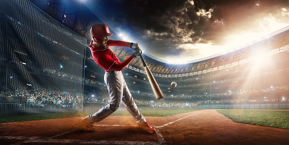 Image of a baseball batter about to hit a ball. He is wearing unbranded generic baseball uniform. The game takes place on outdoor baseball stadium full of spectators under stormy evening sky at sunset. The stadium is made in 3D.