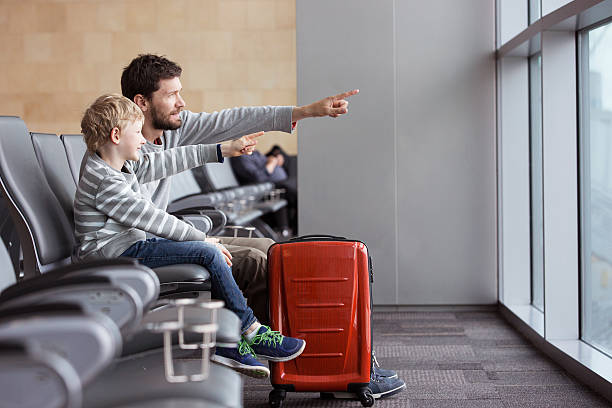 family in airport stock photo