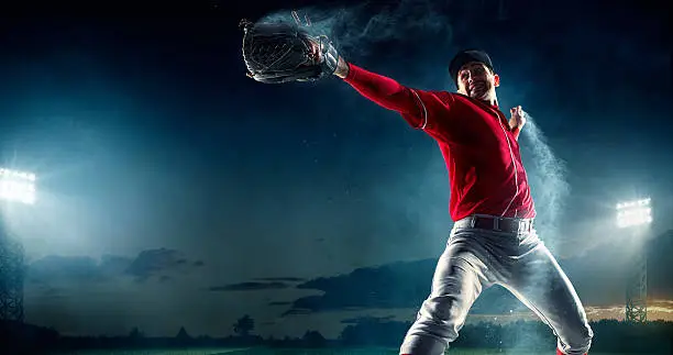 Image of a baseball batter ready to throw baseball. He is wearing unbranded generic baseball uniform. The game takes place on outdoor baseball stadium under stormy evening sky at sunset. The stadium is made in 3D.