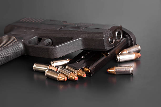 istock 9mm Handgun with Bullets and Magazine 525740678